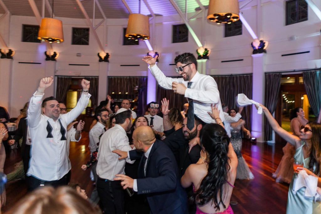 Wedding guests dancing and celebrating at a New Orleans wedding reception.