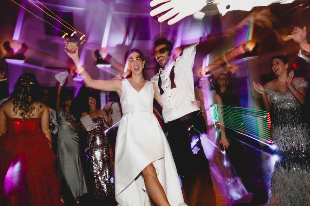Happy bride and groom dancing at New Orleans wedding reception.